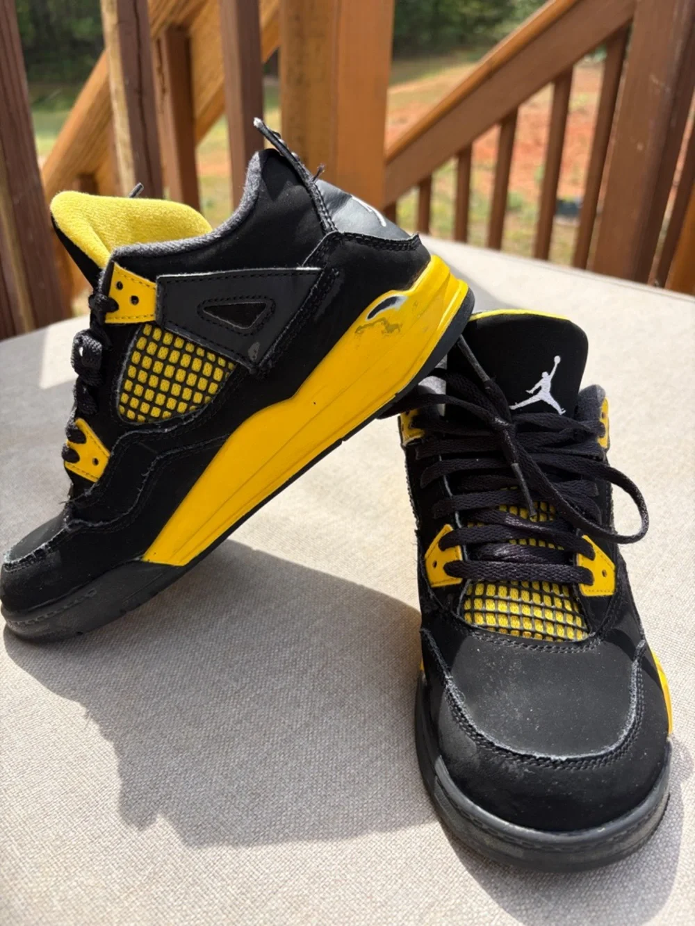 Air Jordan 4 Retro “Thunder” in size 2.5Y GUC.